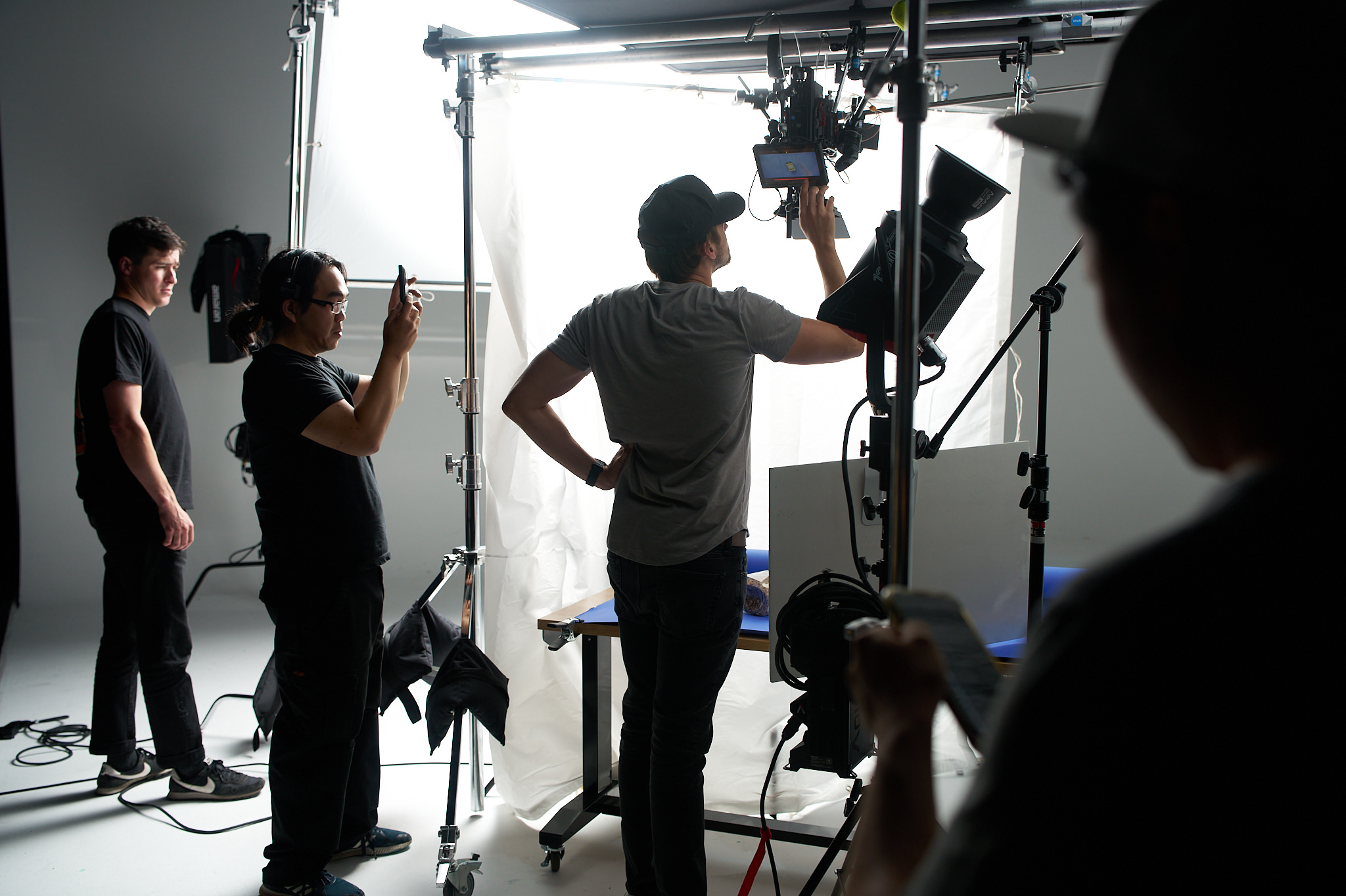 Director reviewing commercial video footage on monitor